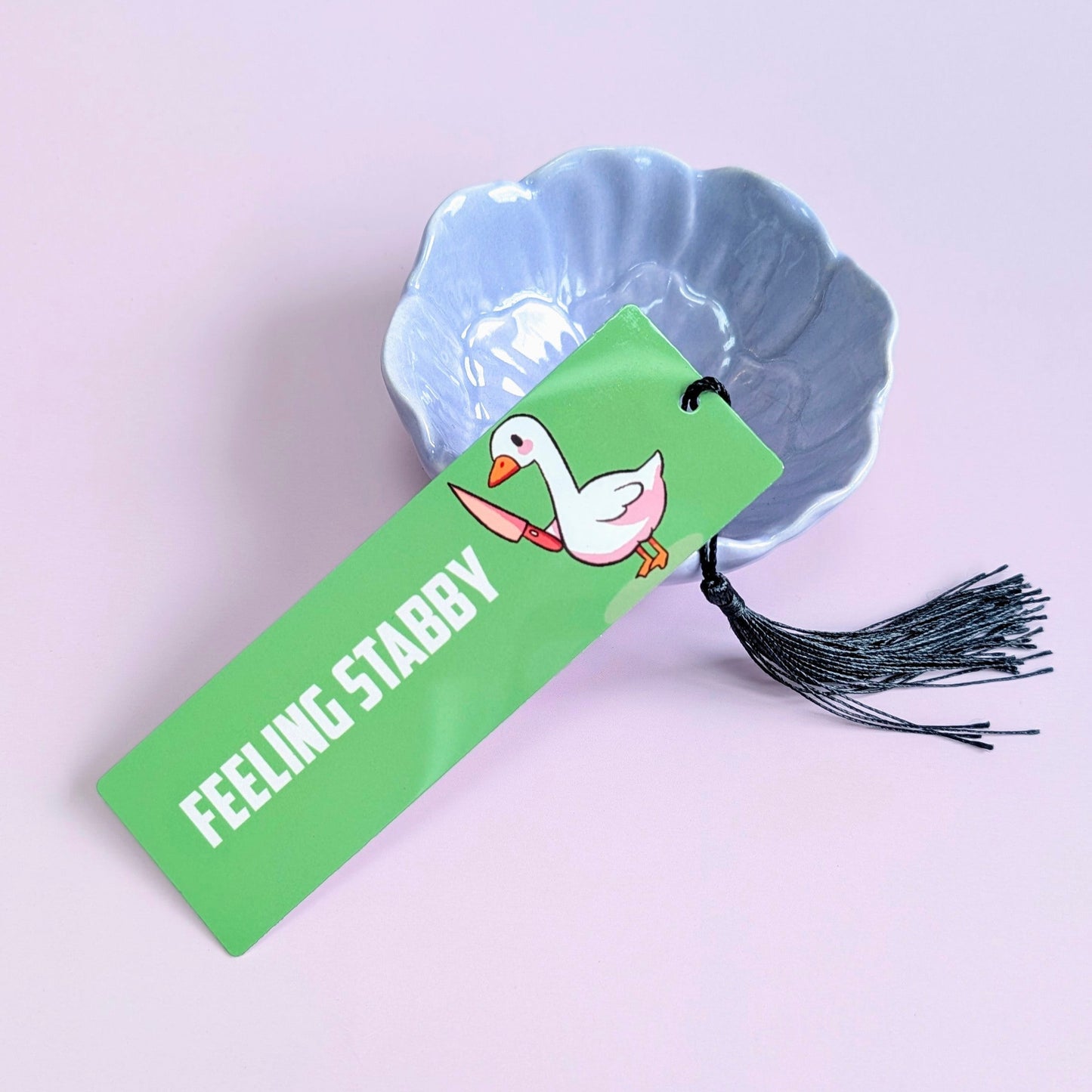 Green bookmark with text 'Feeling Starry' featuring a duck illustration on a light purple background.