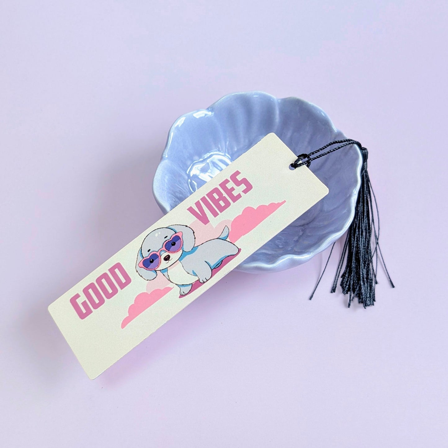 Bookmark with cartoon dog and 'Good Vibes' text on a light purple background