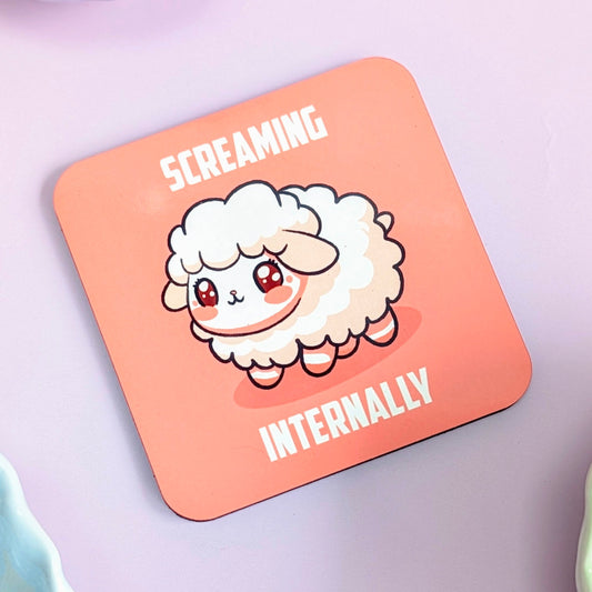 Coaster with cartoon sheep and text 'Screaming Internally' on a pink background