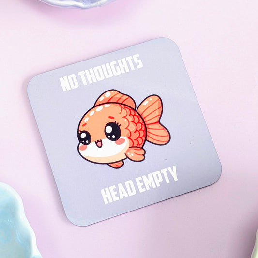 Coaster with a cartoon fish and text 'No Thoughts Head Empty' on a light blue background